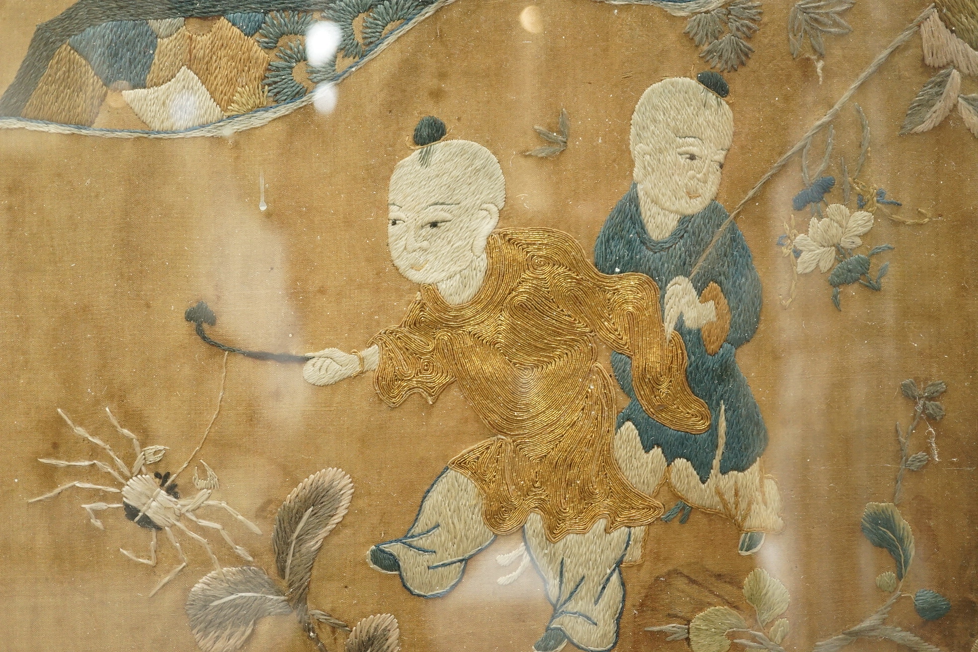 A large Chinese embroidered silk 'boys' panel, 19th century